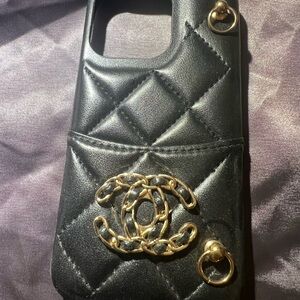 CHANEL Black Quilted Phone Case with Gold Accents